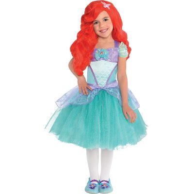 A little girl wears a Princess Ariel costume with a bright orange-red wig.