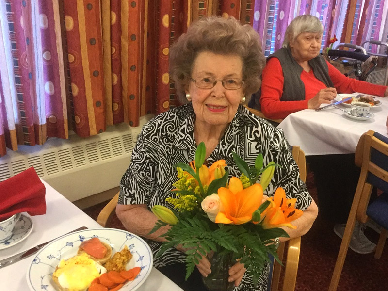 Senior Living Resident with Flowers