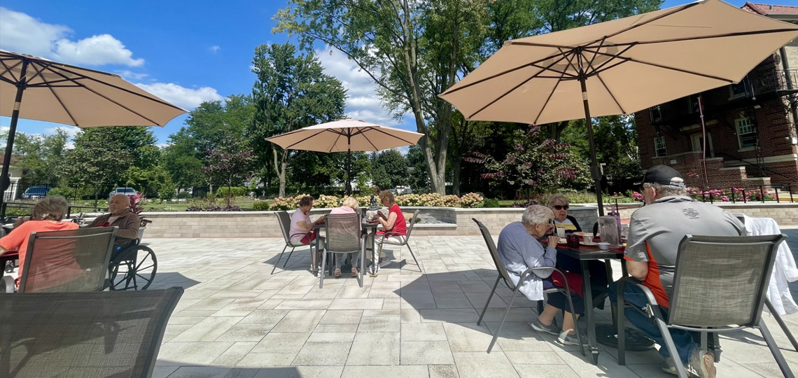 Residents enjoying lunch on the patio