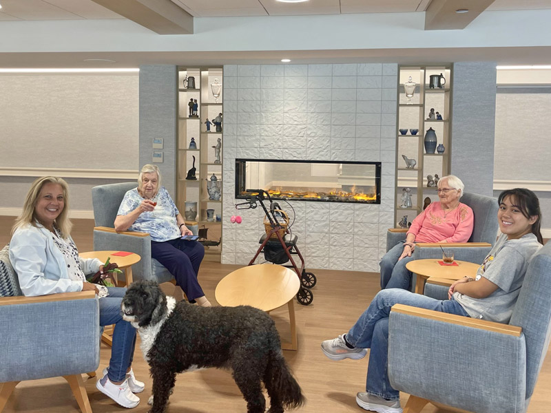 Residents and Staff by the Fireplace